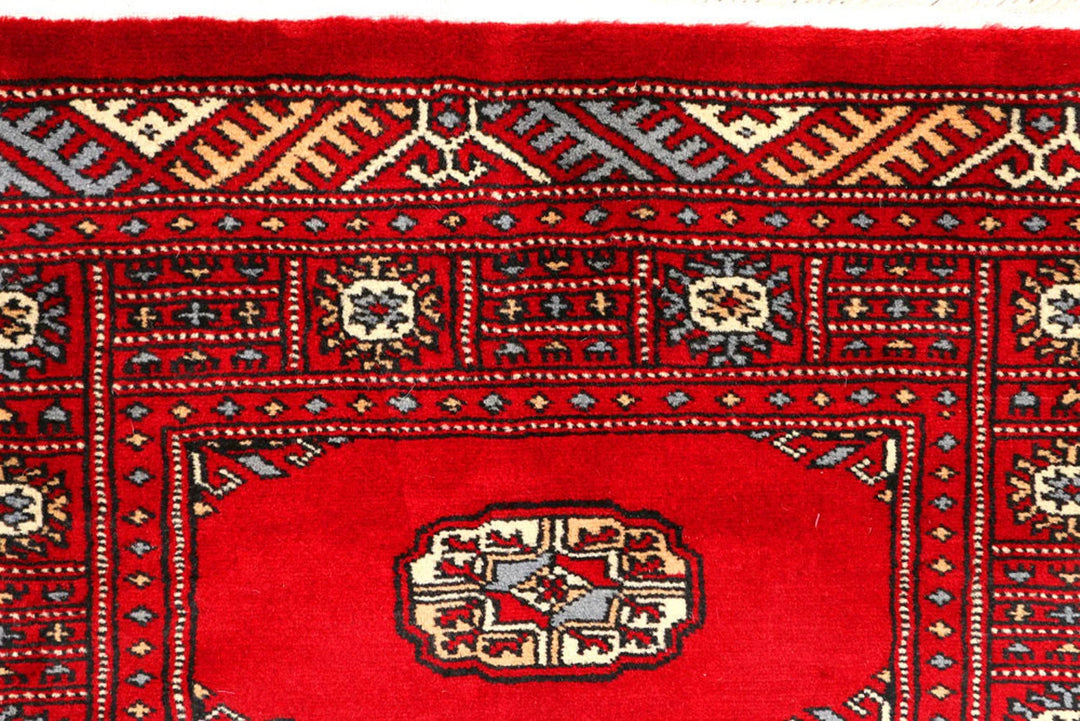 Red Pakistani Bokhara Rug 2' 7" x 8' 11" Hand-Knotted | No. QA27636