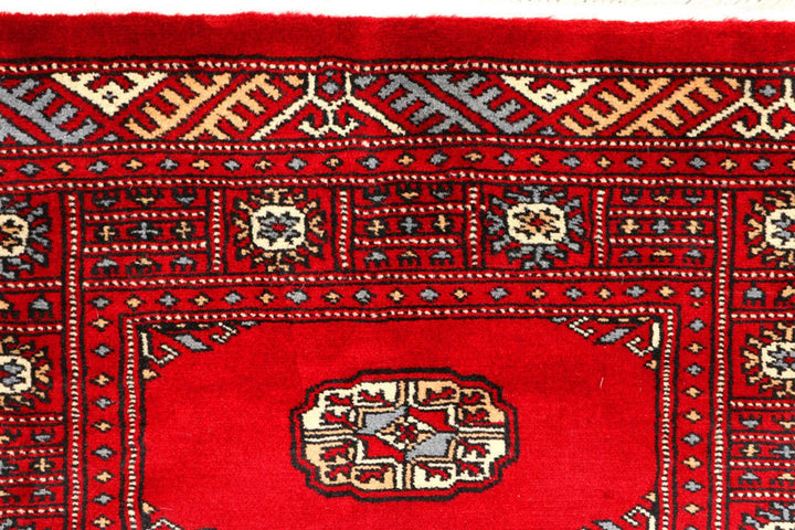 Red Pakistani Bokhara Rug 2' 7" x 8' 11" Hand-Knotted | No. QA27636
