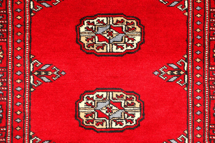 Red Pakistani Bokhara Rug 2' 7" x 8' 11" Hand-Knotted | No. QA27636