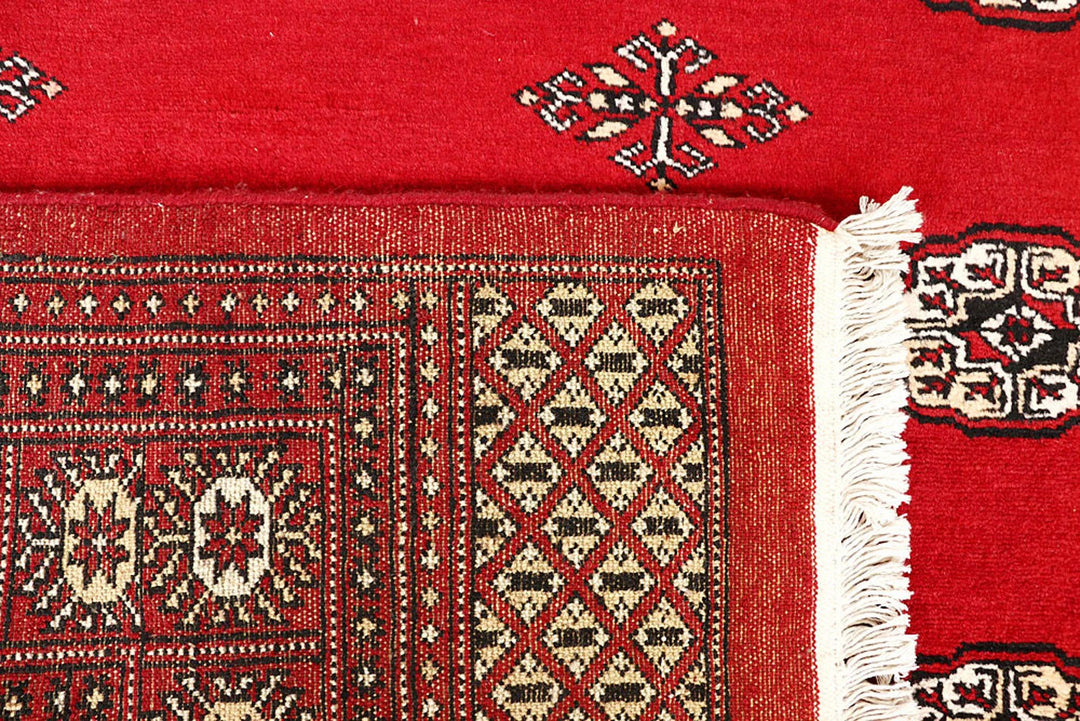 Red Pakistani Bokhara Rug 6' x 9'2" Hand-Knotted | No. QA28209