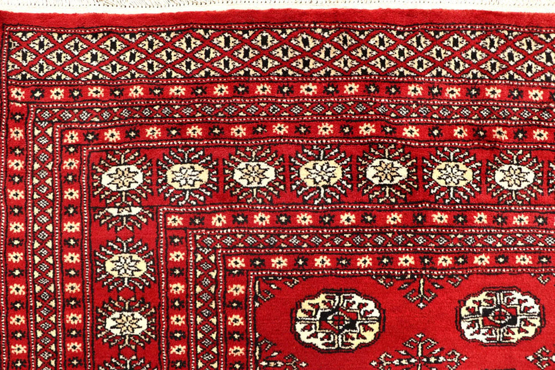 Red Pakistani Bokhara Rug 6' 1" x 9' 4" Hand-Knotted | No. QA28308