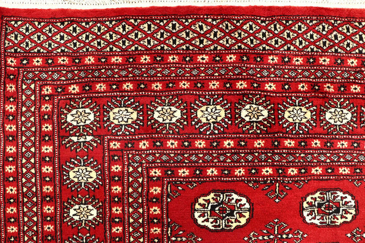 Red Pakistani Bokhara Rug 6' 1" x 9' 4" Hand-Knotted | No. QA28308