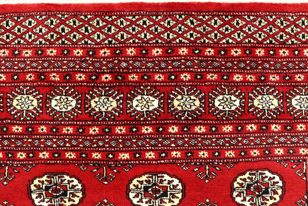 Red Pakistani Bokhara Rug 6' 1" x 9' 4" Hand-Knotted | No. QA28308