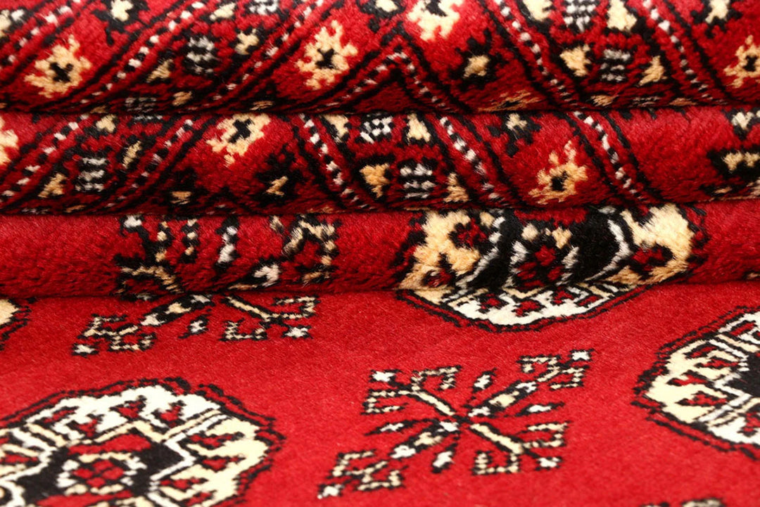 Red Pakistani Bokhara Rug 6' 1" x 9' 4" Hand-Knotted | No. QA28308