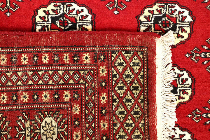 Red Pakistani Bokhara Rug 6' 1" x 9' 4" Hand-Knotted | No. QA28308