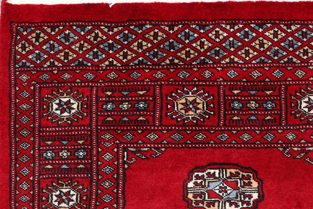 Red Pakistani Bokhara Rug 3' 11" x 6' 3" Hand-Knotted | No. QA28585