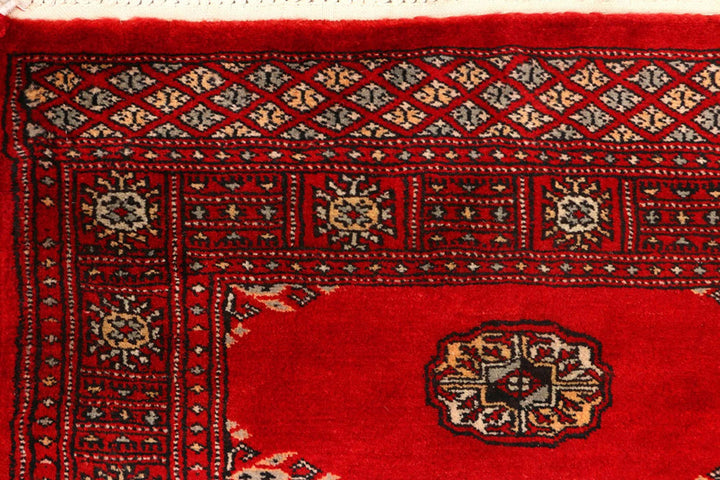Red Pakistani Bokhara Rug 2' 7" x 9' 3" Hand-Knotted | No. QA29390