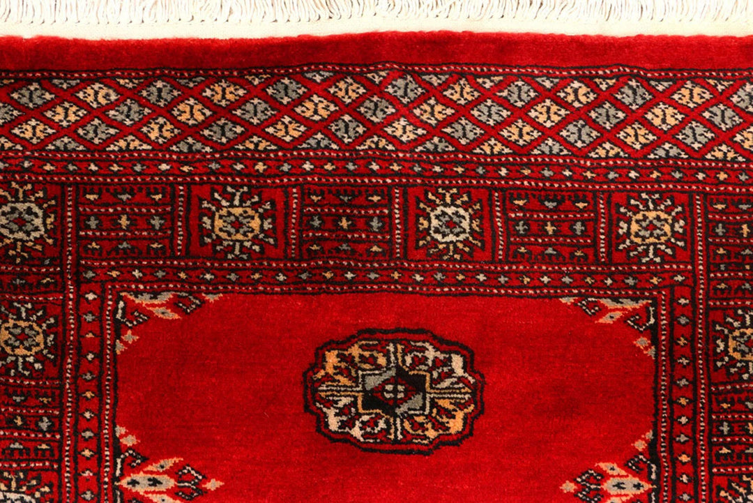 Red Pakistani Bokhara Rug 2' 7" x 9' 3" Hand-Knotted | No. QA29390