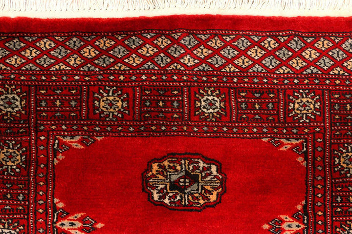 Red Pakistani Bokhara Rug 2' 7" x 9' 3" Hand-Knotted | No. QA29390
