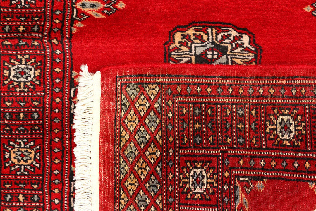 Red Pakistani Bokhara Rug 2' 7" x 9' 3" Hand-Knotted | No. QA29390