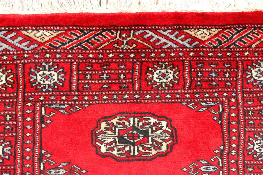 Red Pakistani Bokhara Rug 2' 7" x 6' 2" Hand-Knotted | No. QA29834