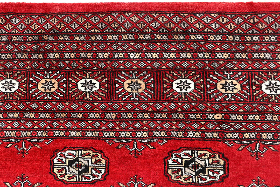 Red Pakistani Bokhara Rug 6' x 9' 3" Hand-Knotted | No. QA29837