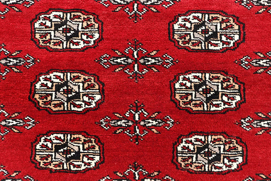 Red Pakistani Bokhara Rug 6' x 9' 3" Hand-Knotted | No. QA29837