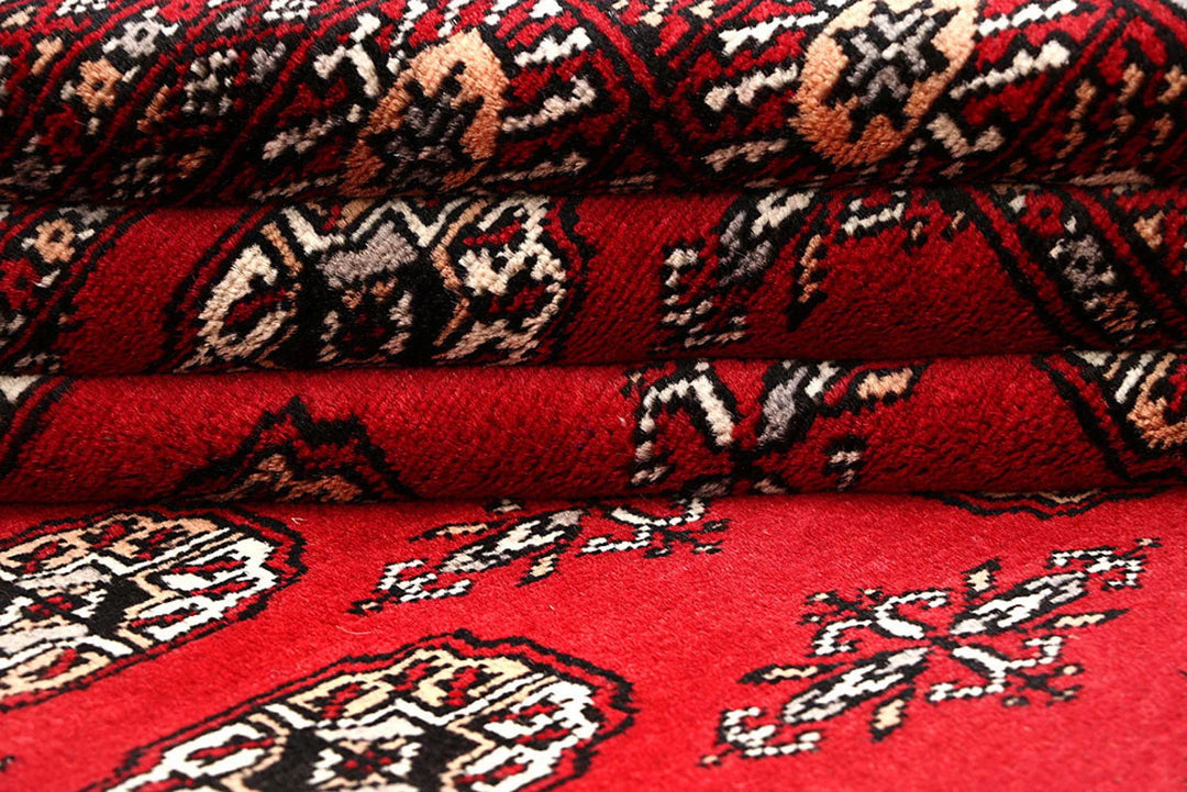 Red Pakistani Bokhara Rug 6' x 9' 3" Hand-Knotted | No. QA29837