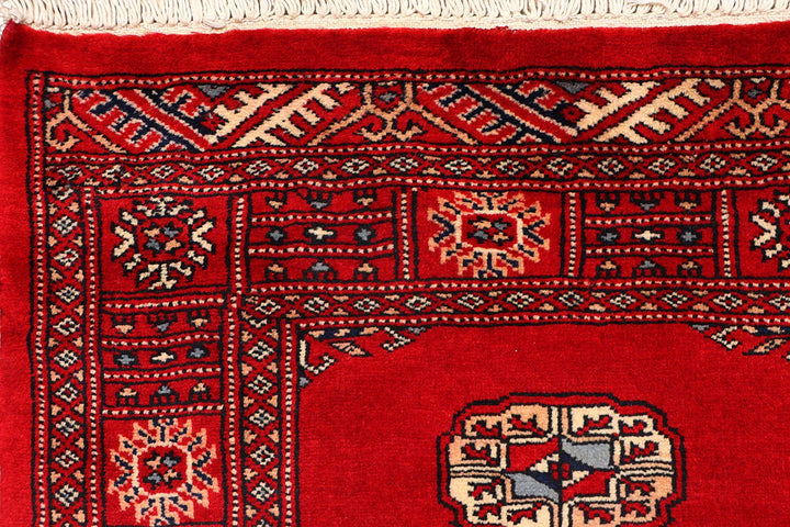 Red Pakistani Bokhara Rug 2' 6" x 10' 2" Hand-Knotted | No. QA32022