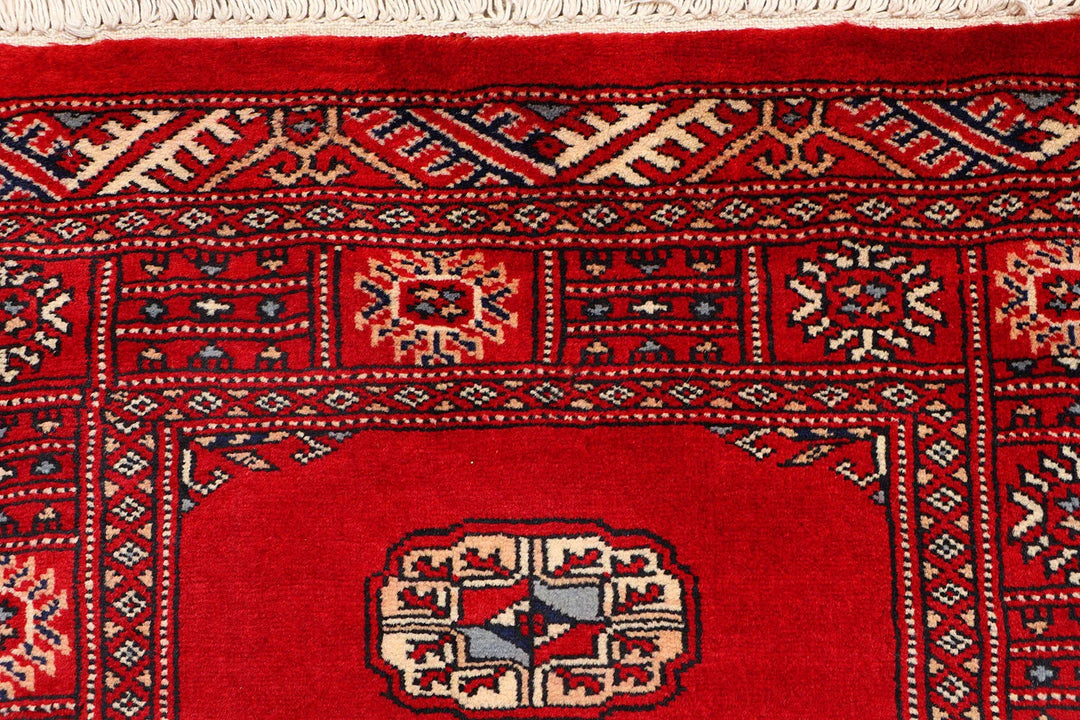 Red Pakistani Bokhara Rug 2' 6" x 10' 2" Hand-Knotted | No. QA32022