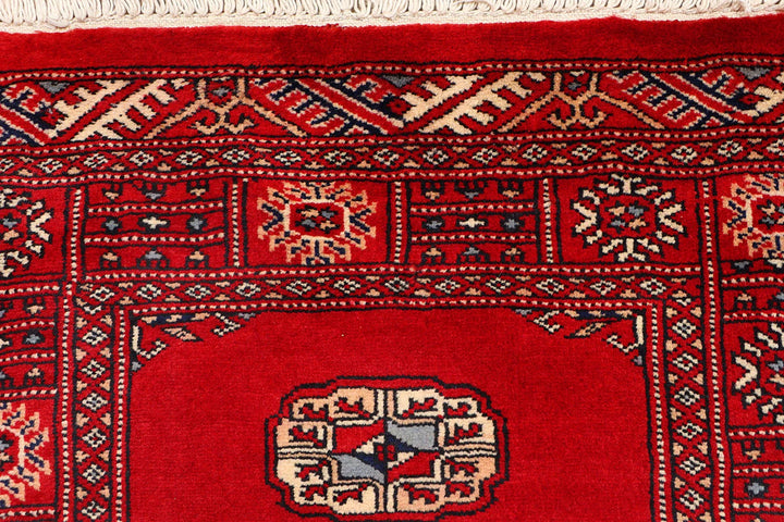 Red Pakistani Bokhara Rug 2' 6" x 10' 2" Hand-Knotted | No. QA32022