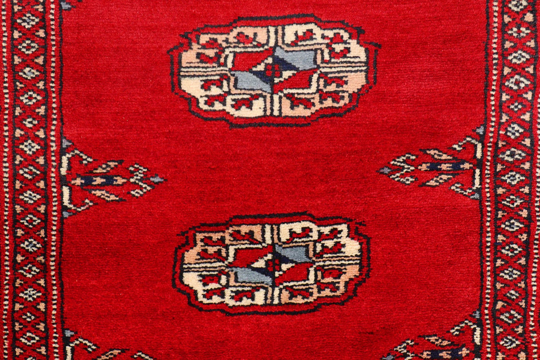 Red Pakistani Bokhara Rug 2' 6" x 10' 2" Hand-Knotted | No. QA32022