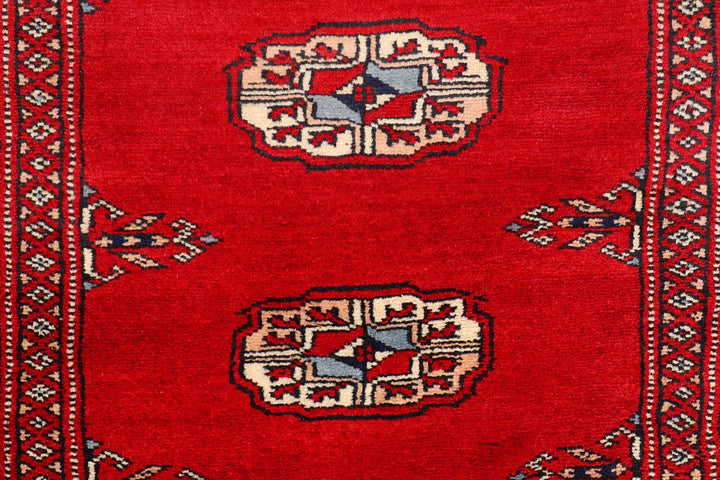 Red Pakistani Bokhara Rug 2' 6" x 10' 2" Hand-Knotted | No. QA32022