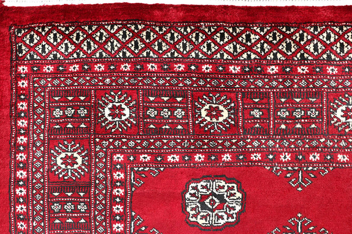 Firebrick Red Pakistani Bokhara Rug 5' 5" x 8' 5" Hand-Knotted | No. QA32596