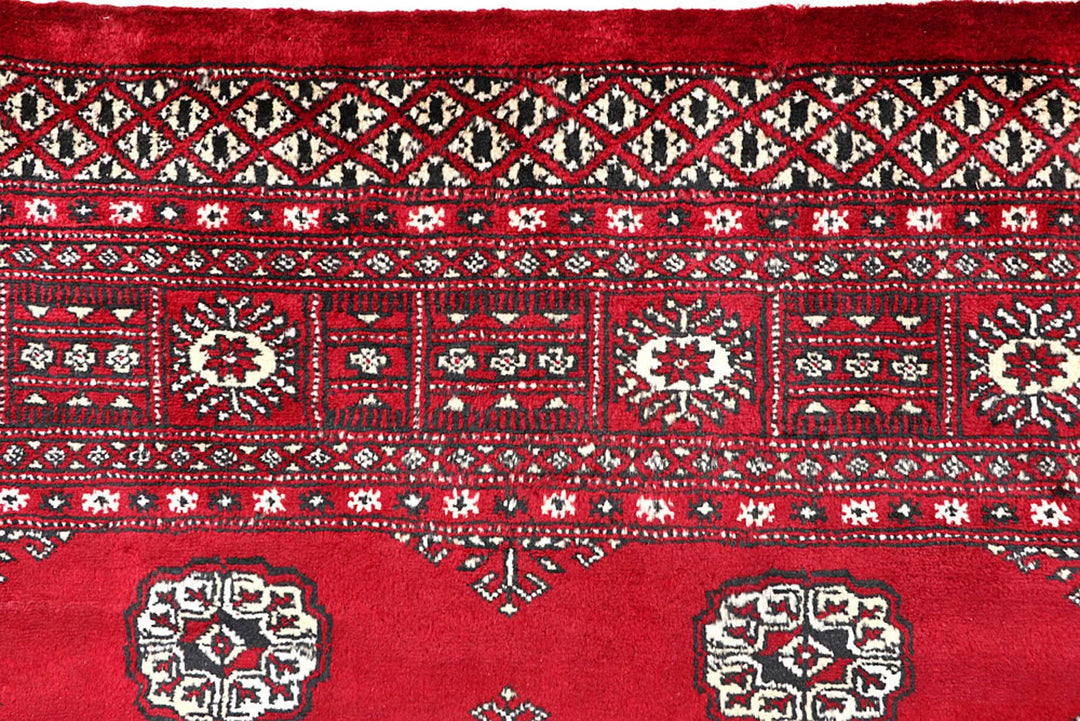 Firebrick Red Pakistani Bokhara Rug 5' 5" x 8' 5" Hand-Knotted | No. QA32596
