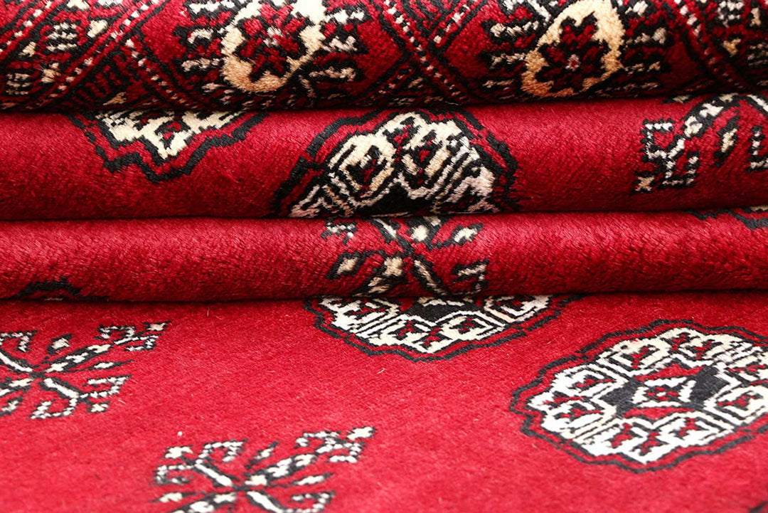 Firebrick Red Pakistani Bokhara Rug 5' 5" x 8' 5" Hand-Knotted | No. QA32596