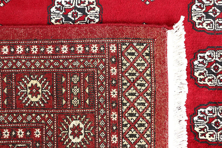 Firebrick Red Pakistani Bokhara Rug 5' 5" x 8' 5" Hand-Knotted | No. QA32596