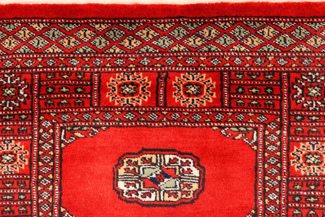 Red Pakistani Bokhara Rug 2' 8" x 12' Hand-Knotted | No. QA32867