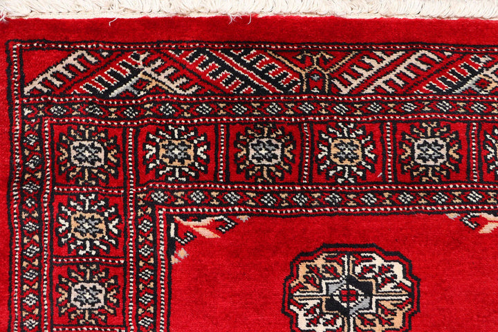 Red Pakistani Bokhara Rug 2' 7" x 10' 1" Hand-Knotted | No. QA33229