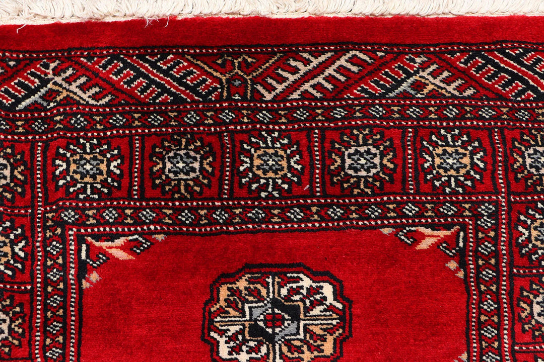 Red Pakistani Bokhara Rug 2' 7" x 10' 1" Hand-Knotted | No. QA33229