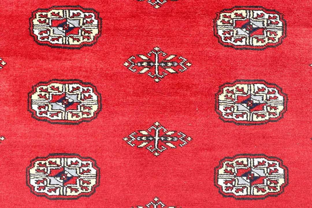 Red Pakistani Bokhara Rug 4' 2" x 6' Hand-Knotted | No. QA34386