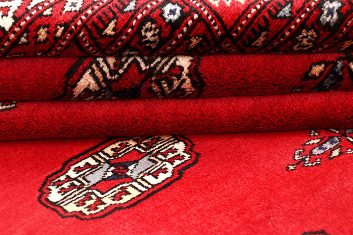 Red Pakistani Bokhara Rug 4' 1" x 6' 9" Hand-Knotted | No. QA34448