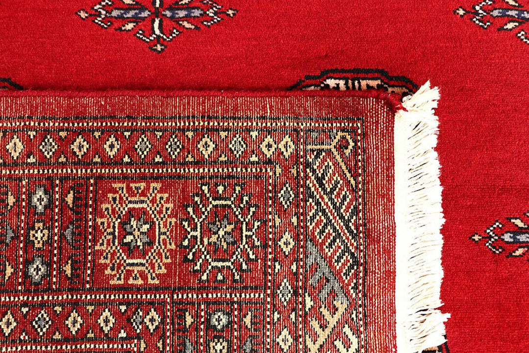 Red Pakistani Bokhara Rug 4' 1" x 6' 9" Hand-Knotted | No. QA34448