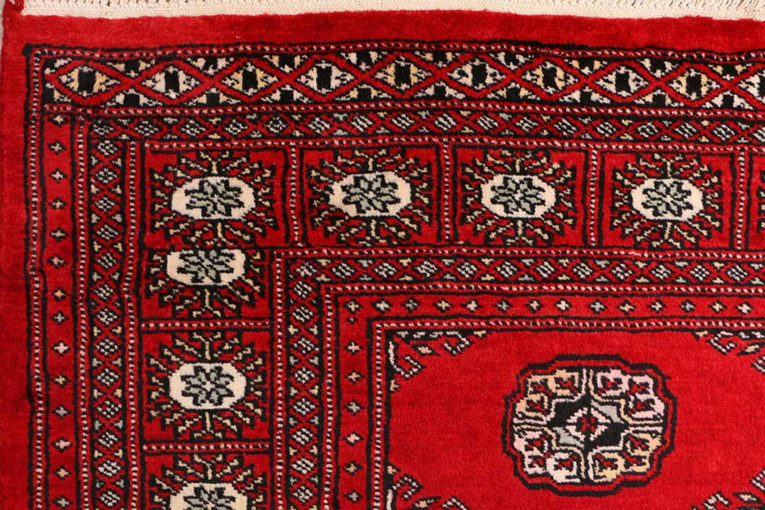 Red Pakistani Bokhara Rug 3' 1" x 5' 8" Hand-Knotted | No. QA34555