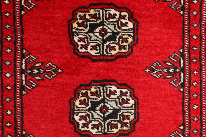 Red Pakistani Bokhara Rug 3' 1" x 5' 8" Hand-Knotted | No. QA34555