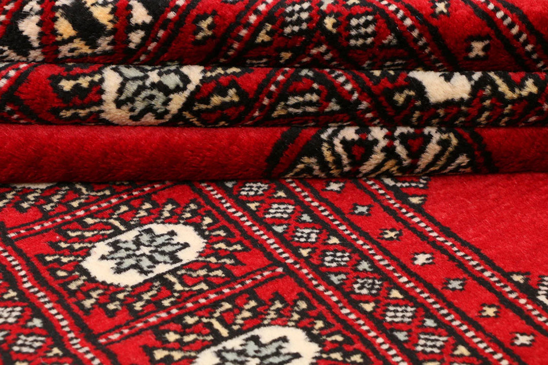 Red Pakistani Bokhara Rug 3' 1" x 5' 8" Hand-Knotted | No. QA34555