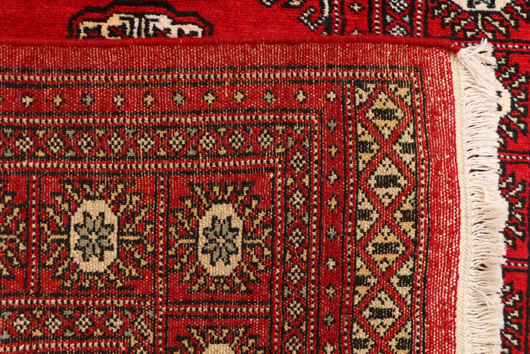 Red Pakistani Bokhara Rug 3' 1" x 5' 8" Hand-Knotted | No. QA34555