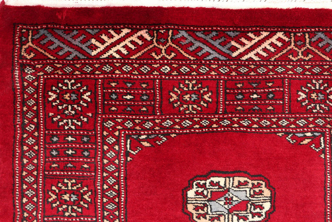 Dark Red Pakistani Bokhara Rug 2' 7" x 11' 11" Hand-Knotted | No. QA35322