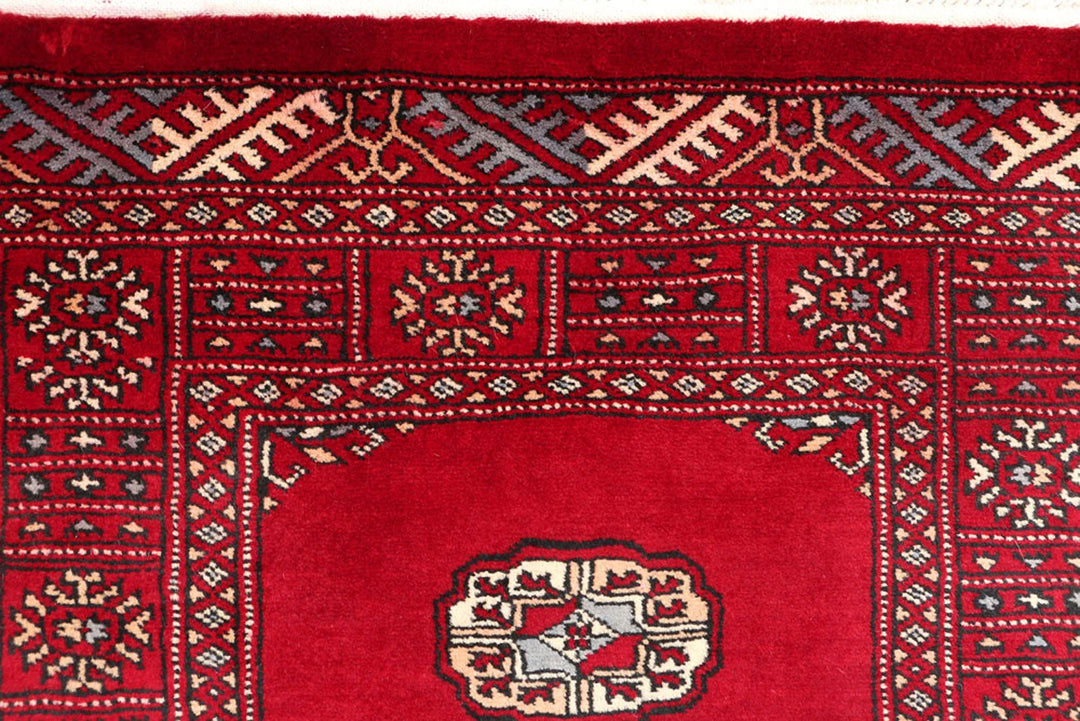 Dark Red Pakistani Bokhara Rug 2' 7" x 11' 11" Hand-Knotted | No. QA35322