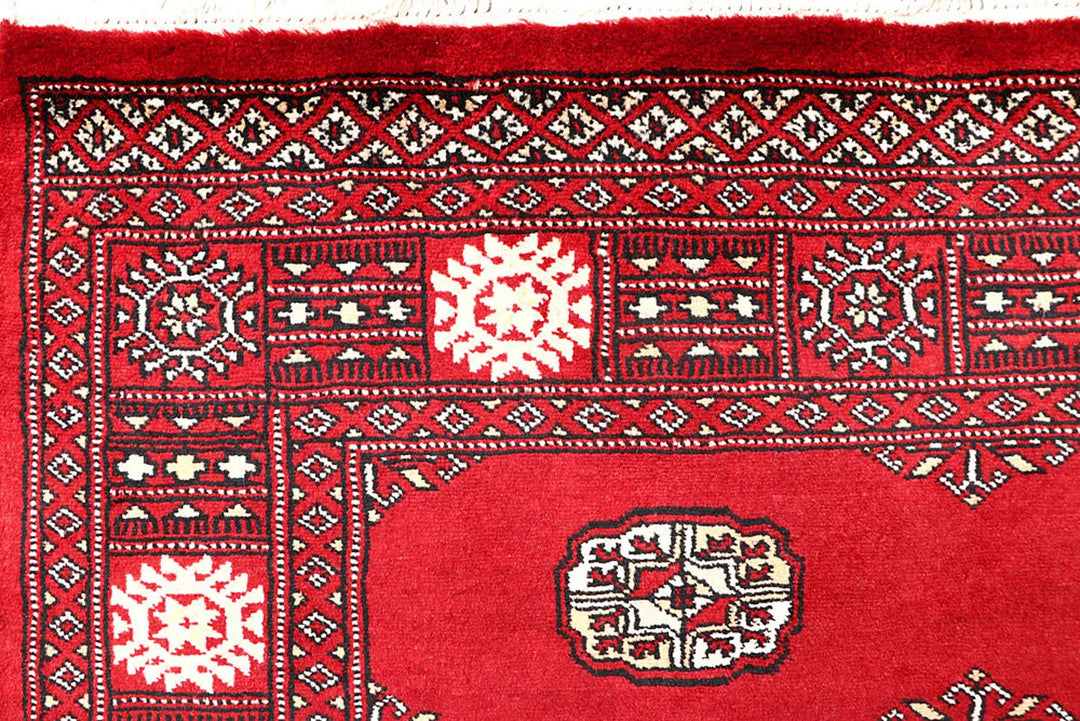 Red Pakistani Bokhara Rug 4' 1" x 6' 6" Hand-Knotted | No. QA35858
