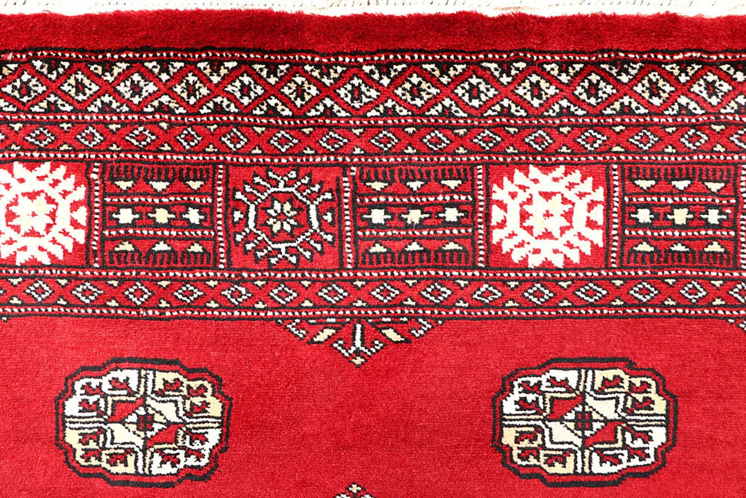 Red Pakistani Bokhara Rug 4' 1" x 6' 6" Hand-Knotted | No. QA35858