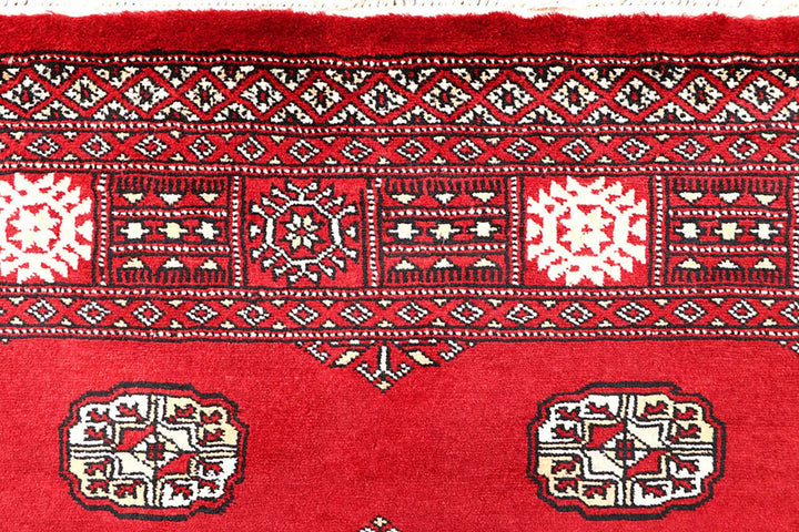 Red Pakistani Bokhara Rug 4' 1" x 6' 6" Hand-Knotted | No. QA35858