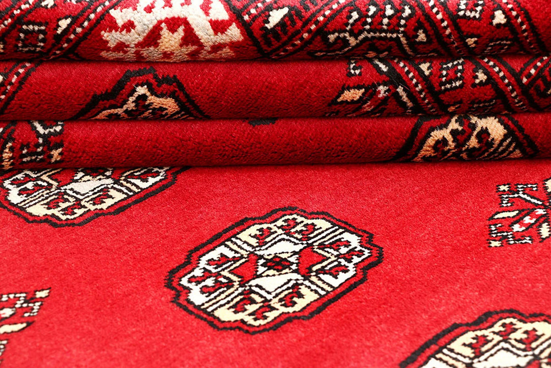 Red Pakistani Bokhara Rug 4' 1" x 6' 6" Hand-Knotted | No. QA35858