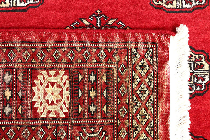 Red Pakistani Bokhara Rug 4' 1" x 6' 6" Hand-Knotted | No. QA35858