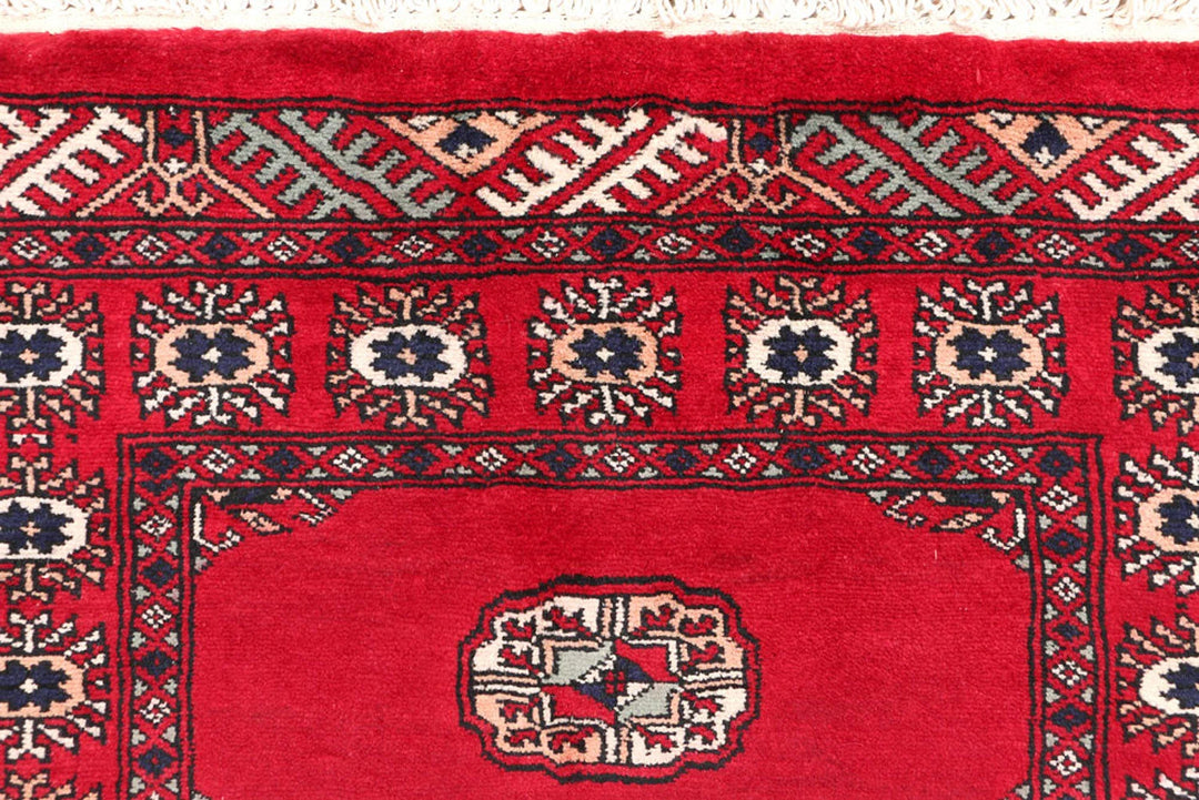 Dark Red Pakistani Bokhara Rug 2' 7" x 9' 9" Hand-Knotted | No. QA38126