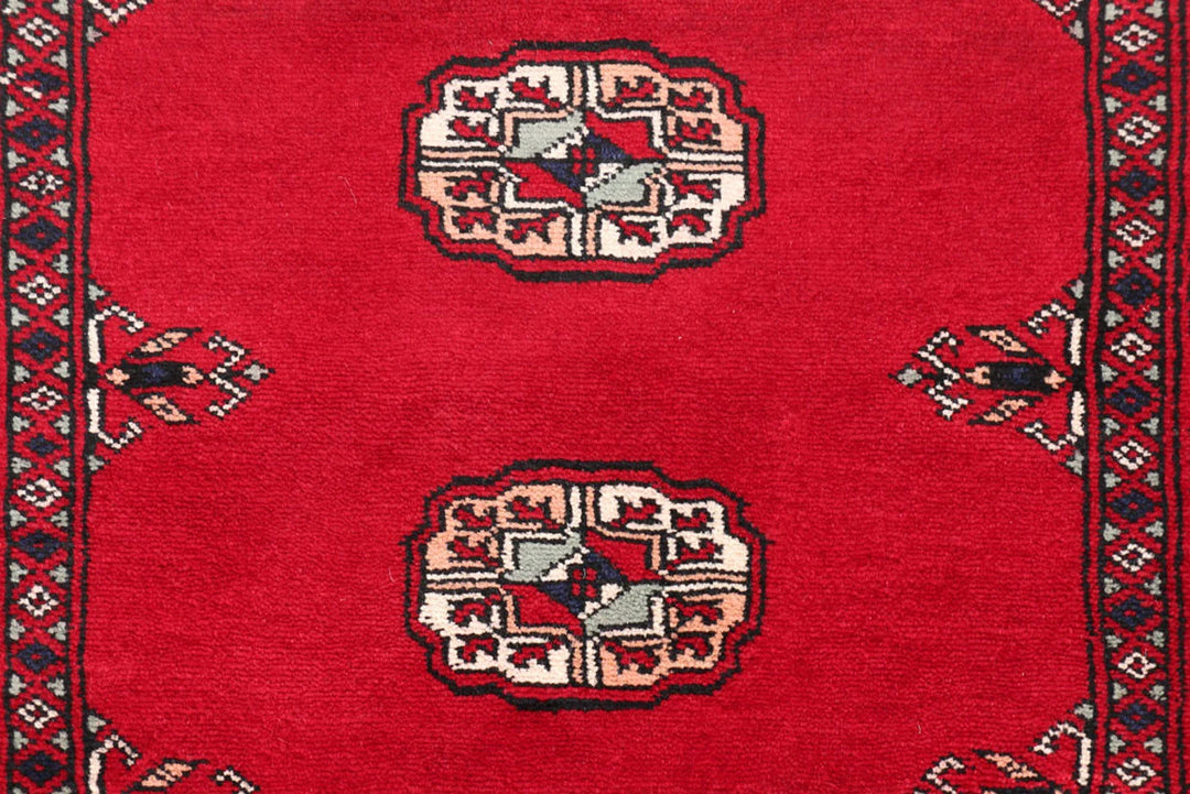 Dark Red Pakistani Bokhara Rug 2' 7" x 9' 9" Hand-Knotted | No. QA38126