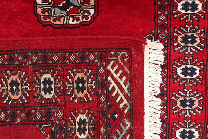 Dark Red Pakistani Bokhara Rug 2' 7" x 9' 9" Hand-Knotted | No. QA38126