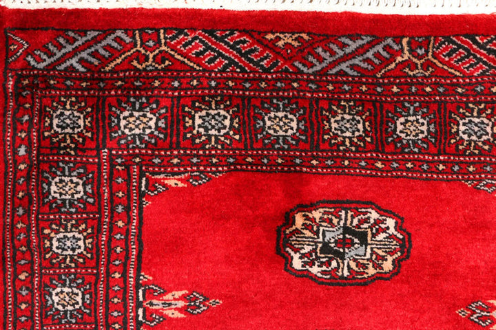 Red Pakistani Bokhara Rug 2' 6" x 9' 1" Hand-Knotted | No. QA38868