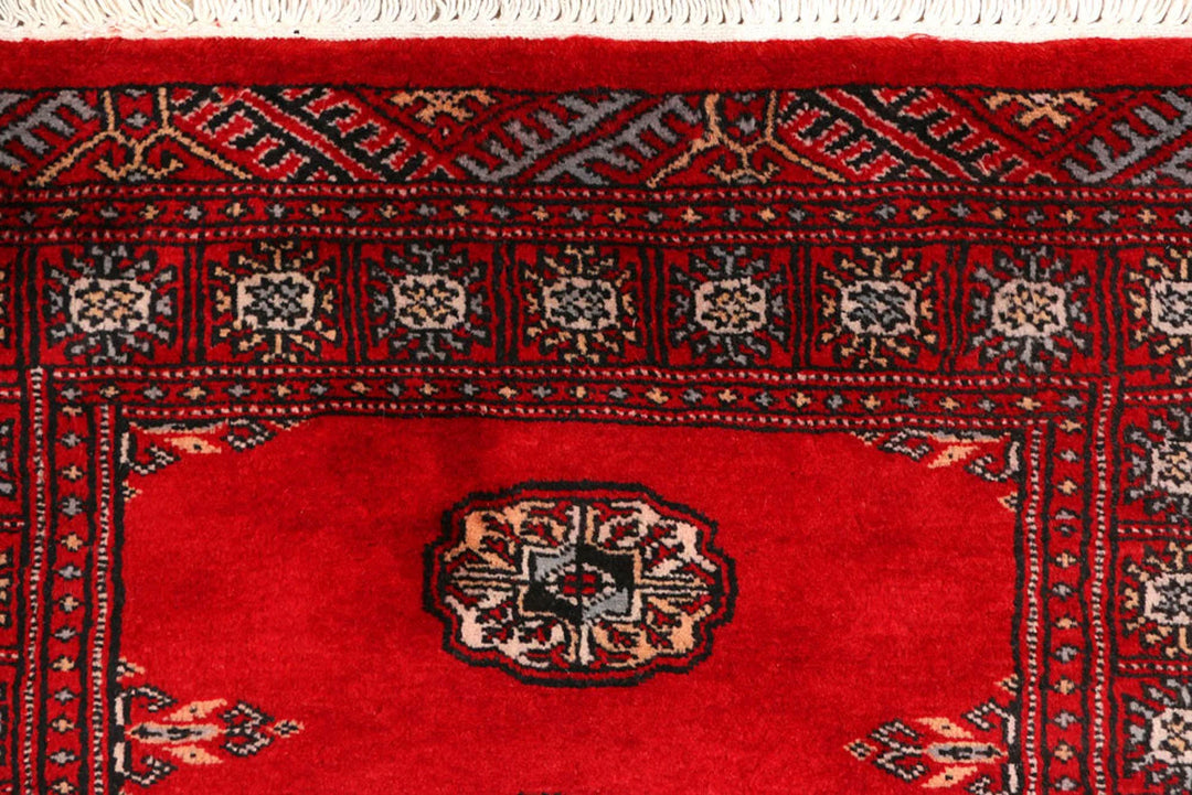 Red Pakistani Bokhara Rug 2' 6" x 9' 1" Hand-Knotted | No. QA38868