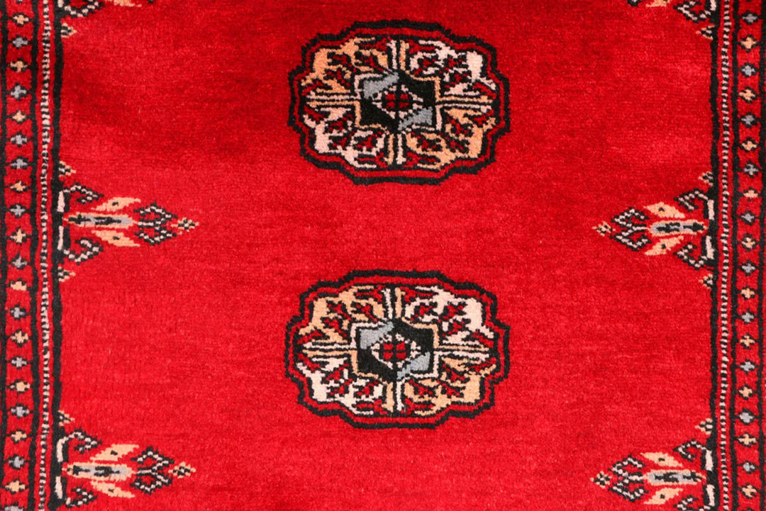 Red Pakistani Bokhara Rug 2' 6" x 9' 1" Hand-Knotted | No. QA38868